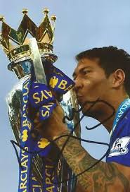 LEICESTER: LEONARDO ULLOA SIGNED 6x4 PREMIER LEAGUE TROPHY PHOTO+COA