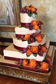 Four Tier Wedding Cake With Champagne Colored Fondant Burnt Orange Roses And Plum Calla Lilies Burgundy Wedding Cake Burnt Orange Weddings Fall Wedding Cakes