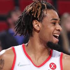 NBA Player Greg Brown has a tattoo sleeve of Sonic running down his right  arm and a crowned Sonic