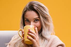 By the window, looking at outside thoughtfully. Free Photo Portrait Of Young Woman Drinking Coffee At Home