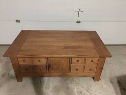 Made of veneers, wood and engineered wood; Broyhill Attic Heirlooms Apothecary Coffee Table In Oak Stain