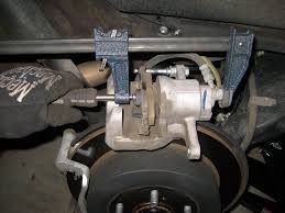 (a) apply disc brake grease to each anti squeal shim. Toyota Sienna Rear Brake Pads Replacement Guide 019