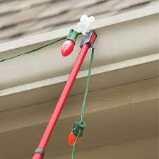 Get free shipping on qualified extension pole christmas light accessories or buy online pick up in store today in the holiday decorations department. The Ladder Free Christmas Light Hanger Hammacher Schlemmer