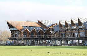 Fram Build Mimics Upturned Viking Boat In Riverside Clubhouse Riverside Clubhouse Clubhouse Design Club House