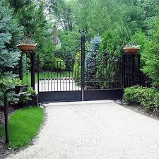 Large Planters On These Driveway Gate Pillars Are Perfect For Adding Seasonal Flowers And Plants Wrought Iron Driveway Gates Metal Driveway Gates Driveway Gate