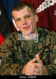 US Marine Lance Cpl. Ryan Chapman, from Harlan, Kentucky, a machine gunner  of the 1st Battalion 3rd Marine Regiment, talks to the media during a news  conference at the Regional Medical Center