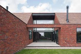 Definition of brick house in the idioms dictionary. Modern Brick House By Koen Van Damme Brick Roof Stocksy United