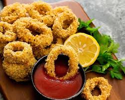 Tra gli altri secondi piatti di pesce vi consigliamo di provare i calamari ripieni al forno. Anelli Di Totano Al Forno Impanati Il Gusto A Cerchietti