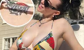 Billie Eilish shows chest tattoo for the first time in rare bikini snap |  Daily Mail Online