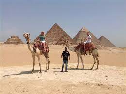 Known as one of the largest and oldest statues in the world. Camel Ride Trip At Giza Pyramids During Sunrise Or Sunset Book Egypt Cheap Tours Sightseeing Trips Activities Best Things To Do
