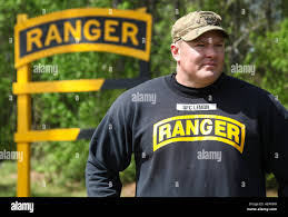 U.S. Army Sgt. 1st Class Robert Lemon, assigned to the 5th Ranger Training  Battalion, observes competitors during the Best Ranger Competition
