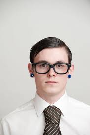 Young Man with Pierced Ears Wearing Shirt and Tie Stock Image