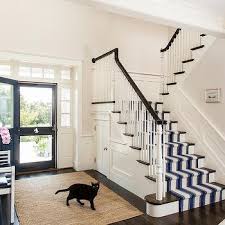 The essence of this design is the contrast between natural texture and a linear design. Jute Stair Runner With Navy Border Design Ideas