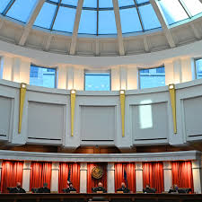 His parents pay all his expenses. Should he get a public defender?