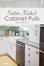 Shop for kitchen cabinet hardware at bed bath & beyond. Transitional Style Of White Kitchen Cabinets Fitted With Stain Nickel Cabinet Pull Hardware And Bin Kitchen Layout Kitchen Design Replacing Kitchen Countertops