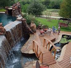 Infinity Pool Going Down Into A Waterfall Into A Pond With A Bridge I Would Love A Backyard Who Needs To Go Away When Dream Backyard Backyard Dream Pools
