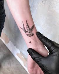 Traditional Swallow And Tiny Zodiac Sign Tattoo On The Left Wrist Wrist Tattoos Side Wrist Tattoos Wrist Tattoos Girls