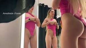 A beautiful girl showed her tight ass in the changing room of a public  store, choosing an outfit for a party. - XNXX.COM