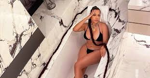 Actress and television host, lala anthony made a major streetstyle fashion statement in the prada nylon gabardine puffer jacket! La La Anthony Puts Her Curves On Display Lying In A Bath In A Skimpy Bikini With A Long Braid