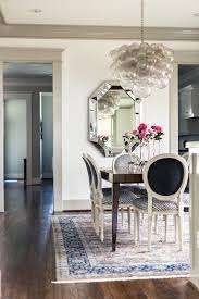 Using modern accessories in your dining room will make the furniture also feel more modern. How Amazing Is That Bubble Chandelier We Love The Modern Touch To The Tradition Dining Room Chandelier Modern Traditional Chandelier Traditional Dining Tables