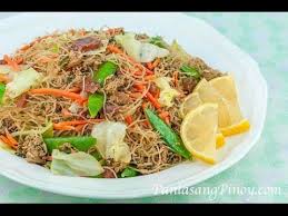 Pancit Bihon Is A Popular Noodle Dish In The Philippines This Recipe Uses Rice Sticks Watch Our Video And Learn How Pancit Bihon Recipe Pancit Recipe Pancit