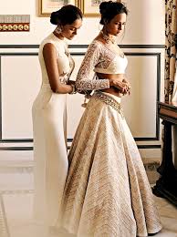 This breathtaking wedding gown offers a strapless and sweetheart neckline. Cream And Gold Indian Wedding Dress Indian Weddings Trousseau By Soma Sengupta