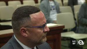 Lorain County Prosecutor J.D. Tomlinson, chief of staff James Burge speak  after arraignment