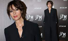 We tried to answer this curious question with. Monica Bellucci 55 Exudes Sophistication In A Black Jumpsuit As She Attends Glitzy Event In Paris Daily Mail Online