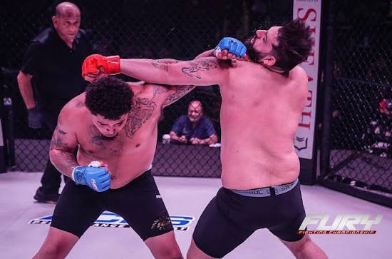 Terrance Chatman throwing a right hand in a Fury Fighting Championship heavyweight bout