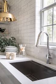 A Florida Designer Reinvents Her Kitchen By Removing The Upper Cabinets Kitchen Remodel White Subway Tiles Kitchen Backsplash Kitchen Renovation