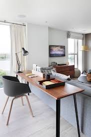 25 Ways To Pull Off An Office Nook In A Living Room Living Office Living Room Office Combo Desk In Living Room Living Room Office