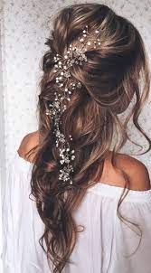 With a knot on top and below, you'll keep your hair away from your face and look as elegant as ever. 23 Exquisite Hair Adornments For The Bride Long Bridal Hair Hair Styles Long Hair Vine