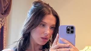 Millie Bobby Brown Shows Off Her Toned Body in a Baby Tee and Pearls