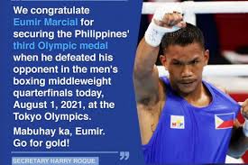 31, 2018, file photo, phillippines' eumir felix marcial, left, and uzbekistan's israil madrimov fight in their men's middleweight boxing semifinal at the 18th. Ki7uvqwo38ushm
