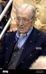 Former UCLA coach John Wooden, center, stands with two of his former  players Kareem Abdul-Jabbar, left, and Bill Walton during a news conference  at the Anaheim Hilton Hotel in Anaheim, Ca., March