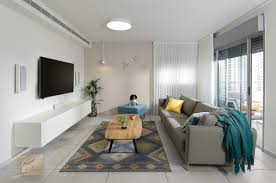Make a statement by grouping similar objects like vases, bottles or bowls together, so that they become a stronger design element as a whole than they would be individually. Planning Interior Design And Home Styling For A Contractor Apartment In Holon Bunreal Interior Design And Design