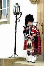 Bagpiper Wearing A Traditional Scottish Costume With A Bear Skin Hat And Kilt Scottish Fashion Scottish Costume Scottish Bagpipes