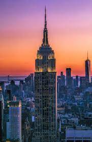 As products of the interaction of light from the low sun with the atmosphere, sunsets create and impressive arrays of colors and shadows. New York City Empire State Building Sunset Painting By Christopher Arndt