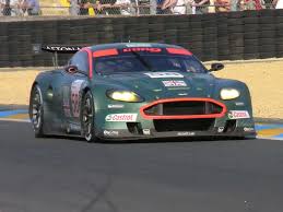Metallic Green With Red Orange Highlights Provides Conspicuity Aston Martin Aston Martin Dbr9 Sport Cars