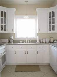 When you want to pair your white kitchen cabinets with gray wall paint but do not want the wall to look cool or neutral, you can choose greige instead. Kitchen Colors With White Cabinets Beige Kitchen White Cabinets White Appliances