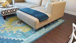 When selecting an area rug, make sure that it extends under all the key pieces of furniture in the room. 5 Rug Rules I Broke In My Living Room School Of Decorating