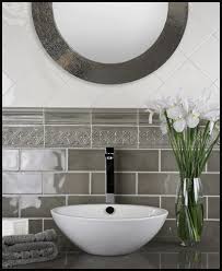 Subway Tile Trends Subway Tile With Decorative Borders And Accent Pieces This Subway Tile Trend Mixes Decor Custom Tile Shower Tile Bathroom Bathroom Makeover