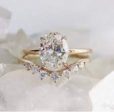 Really Loving These Rings With The Extra Curved Band Don T Remember The Name Of The Band Though Wedding Rings Oval Unique Engagement Rings Wedding Rings Halo