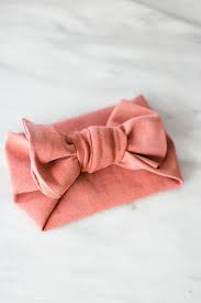 If using clips and you want a firmer bond than the one you get with the glue, insert the ribbon to the center of the bow and loop through the arched string of the clip. Diy No Sew Baby Bow Head Wrap Something Turquoise