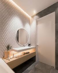 This bathroom uses its neutral, modern design to really give space to the zebra skin rug here. Bathroom Tiles Design In India Simple Bathroom Remodel Cheap Bathroom Remodel Bathroom Vanity Remodel