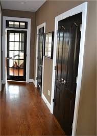 Black Doors White Trim Wood Floors Brown Walls Black Interior Doors Home Decor Home