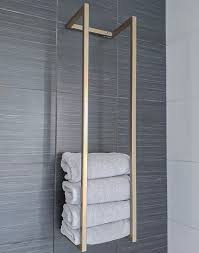 On the opposite side of the vanity, a unique hexagon shelving unit provides consider towel holder ideas as part of your bathroom's decor. Towel Rack 36 Metal Towel Holder Towel Storage Towel Rack Bathroom Towel Holder Bathroom Interior Design Bathroom Interior Bathroom Design Luxury