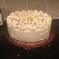 Sprinkle the prepared coconut topping over the center of the cheesecake, leaving a the cheesecake to loosen it from the bottom of the springform pan; Coconut White Chocolate Cheesecake