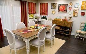 The dining room consists of chairs with striped fabrics. The Homes Of Abc S Modern Family Small Dining Room Table Dining Room Small Dining Room Design