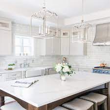 The white quartz material gets its marble appearance due to the black, white, and grey veins that move throughout the stone. White Kitchen Countertops Pictures Ideas From Hgtv Hgtv